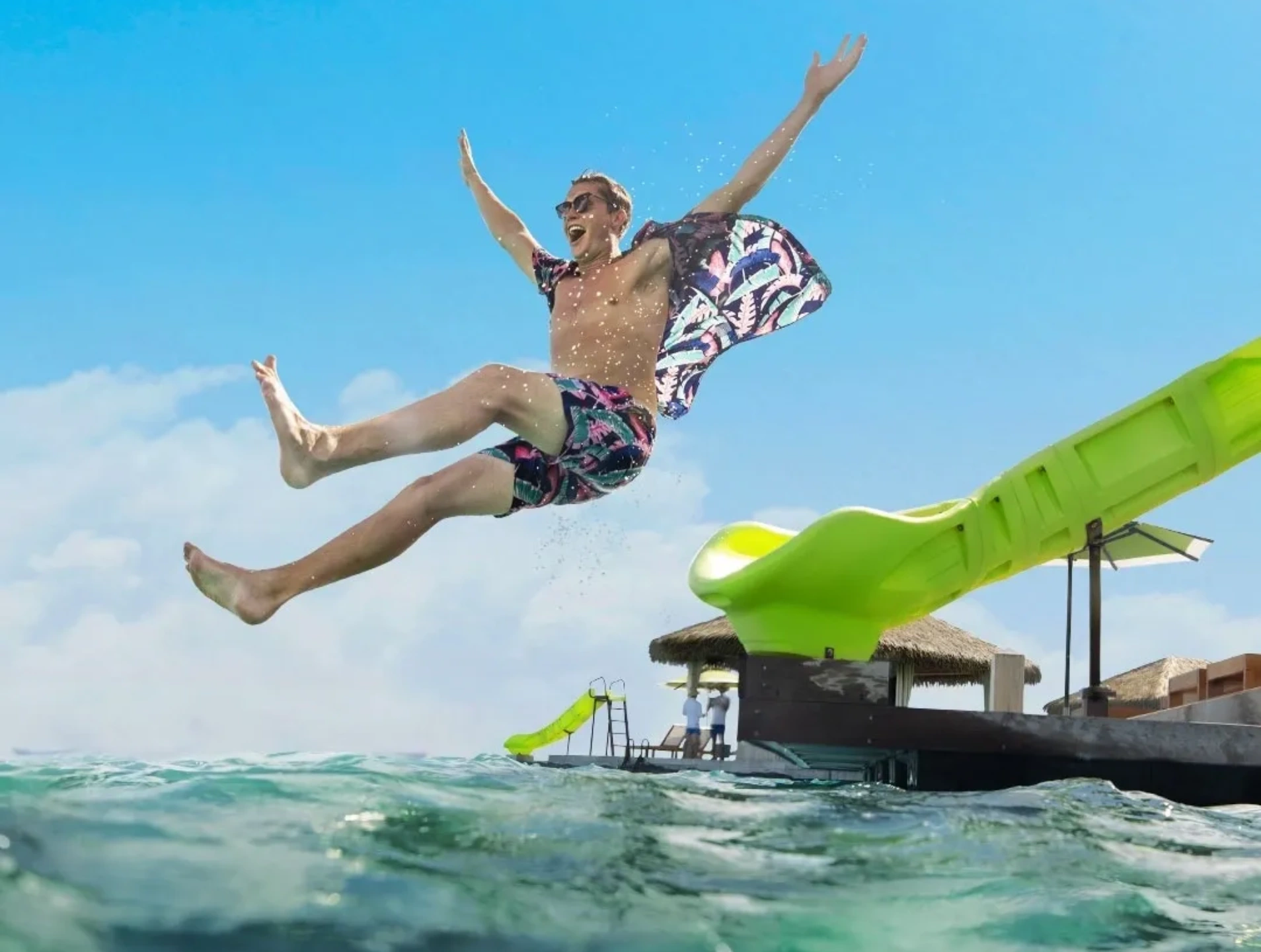 A man jumping in the air over water book travel